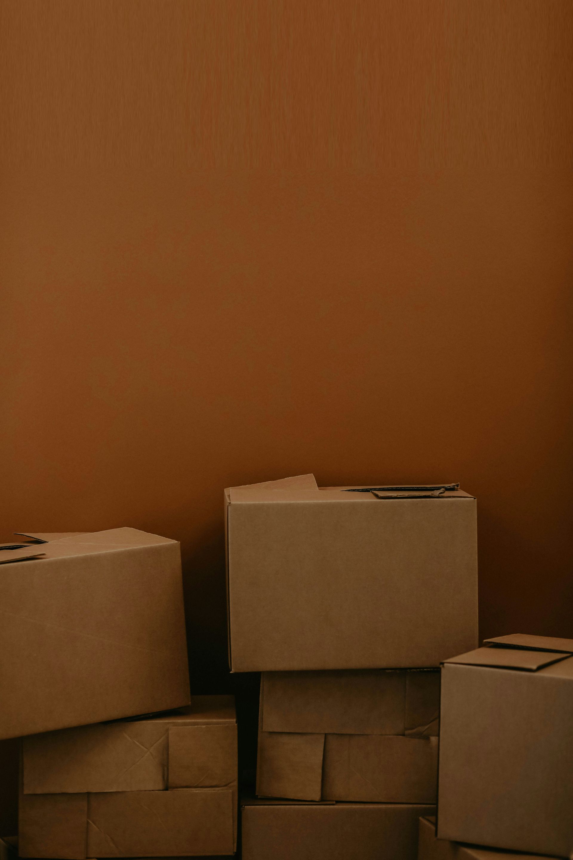 white cardboard box on brown wooden table